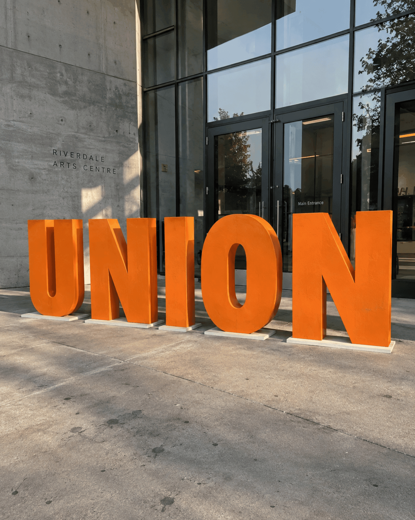 Large orange freestanding UNION letters