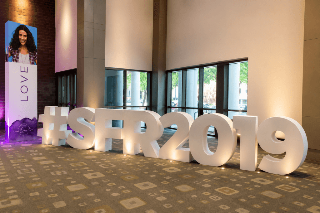 Large white freestanding hashtag STR2019 letters